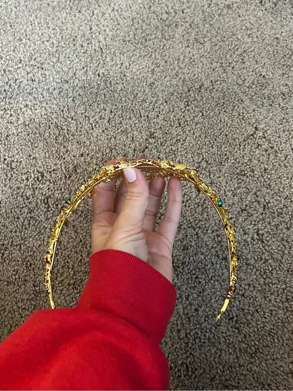 Gold colored crown headband with red and green faux gemstones
